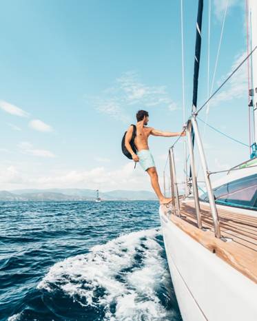 The Luxurious Fishing Fleets Available at Tag Cabo Sportfishing 3 a man standing at the edge of the ship