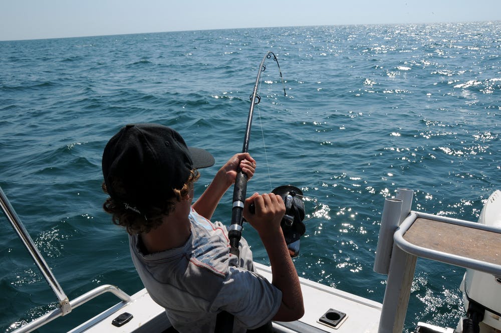 Things You Need for a Luxurious Fishing Experience 3 Photo of a man fishing