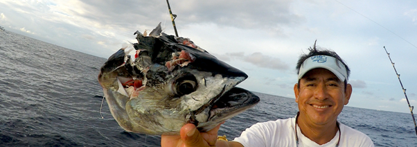 What Makes A Great Sportsfishing Trip? 1 An angler showing off his catch.