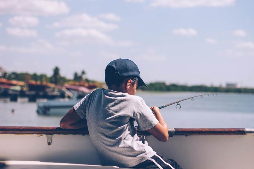 Fishing Hacks Everyone Needs to Know 1 A boy sportfishing in Cabo San Lucas on a luxury yacht charter.