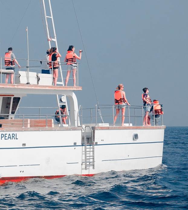 Boating Safety Tips 2 people on a boat wearing lifejackets
