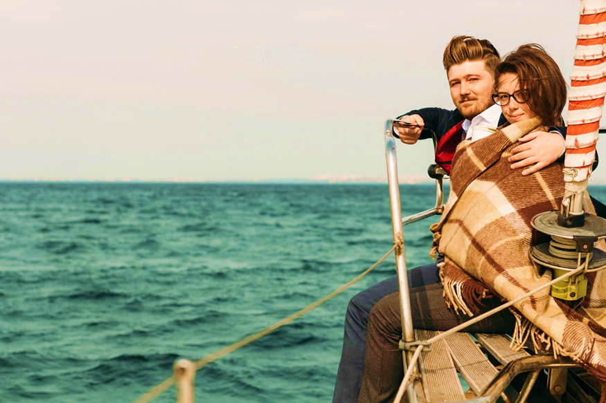 Plan A Romantic Getaway With Your Partner To Cabo 2 A couple out in the sea on a yacht
